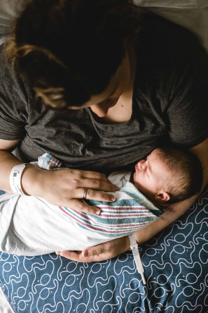 Mom holding newborn baby after c-section