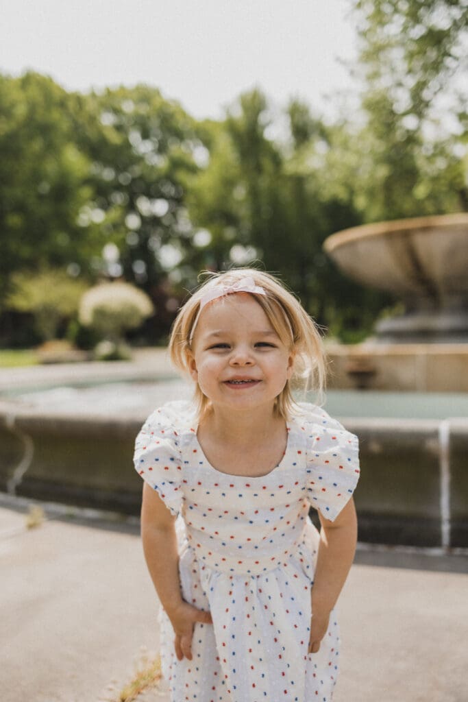 Little girl smiling at Cleveland Cultural Gardens