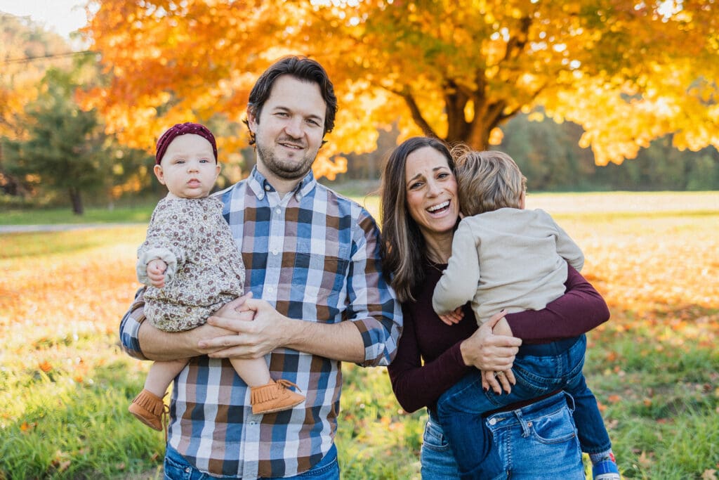 Family of four in a field during Cleveland family photography session