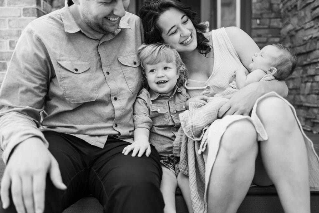 Family of four on front porch of their home in Cleveland, OH