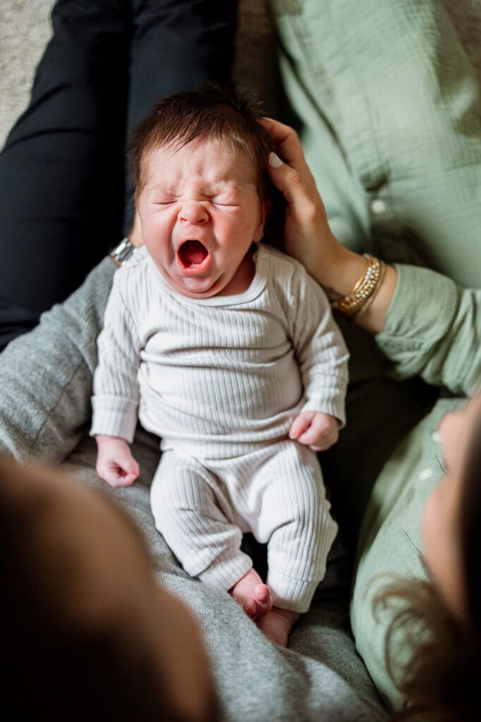 Baby boy yawning during Chagrin Falls newborn photography session
