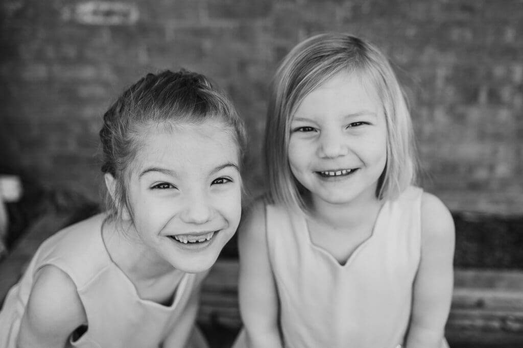 Sister together at Rockefeller Park Greenhouse family photography session in Cleveland