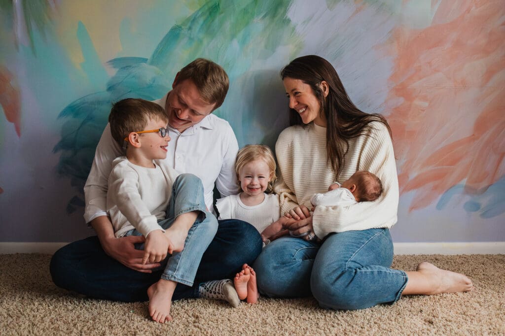 Family of five in nursery during Pepper Pike newborn photography session