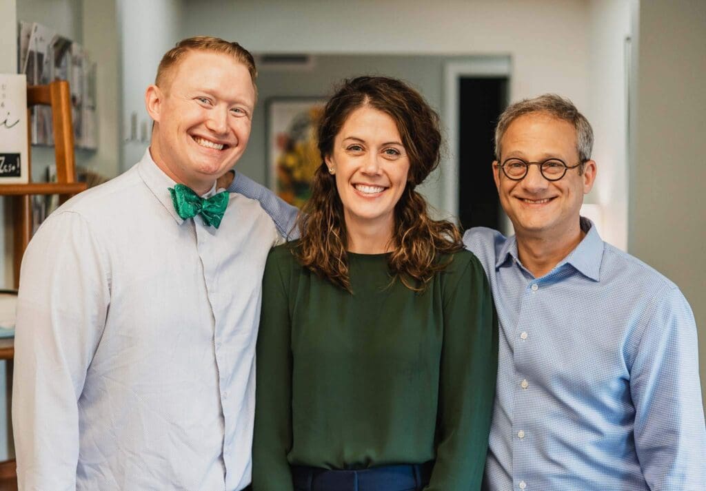 Three pediatricians from Zest Pediatrics in Cleveland, OH, smiling in their office, providing personalized pediatric care for families.