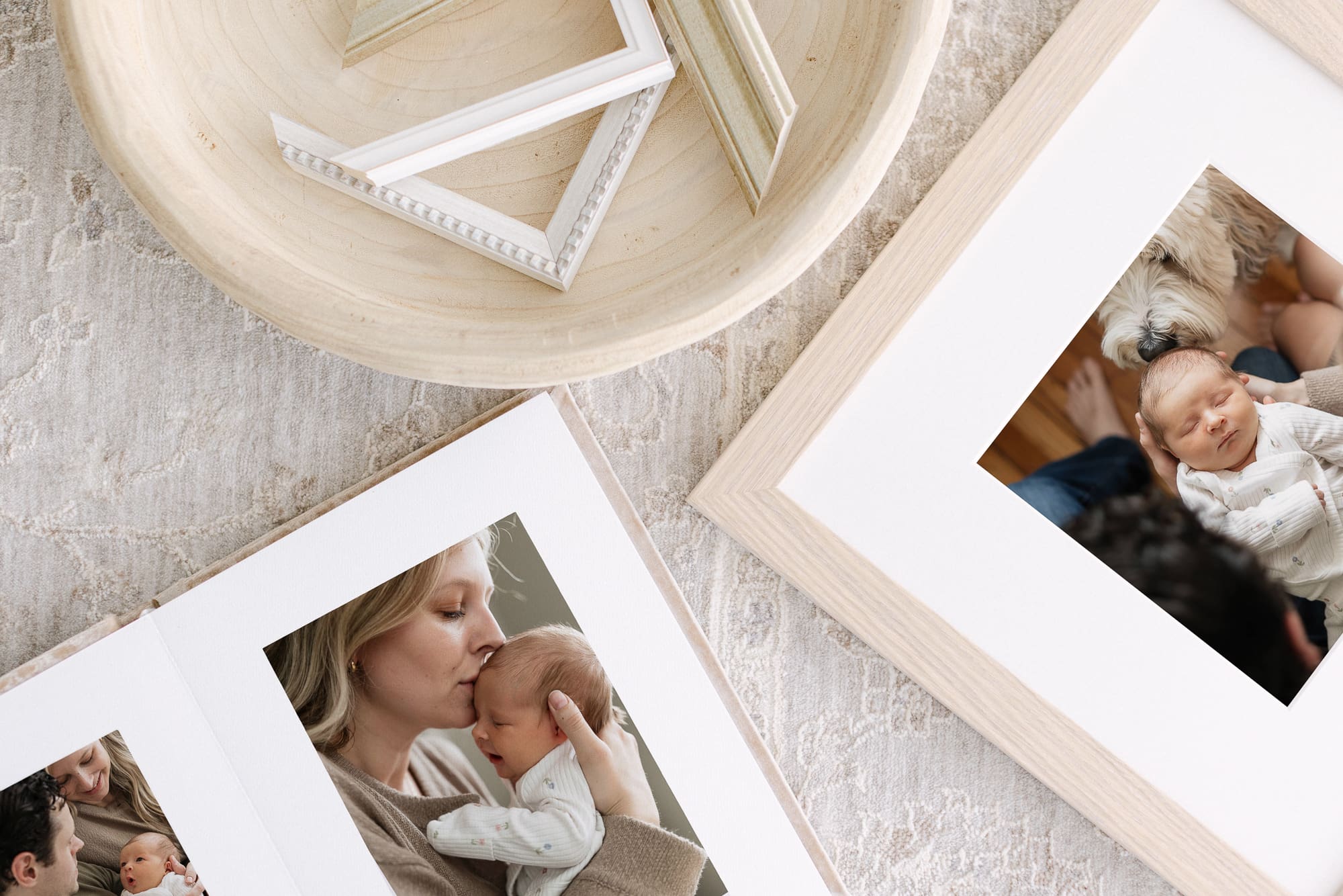 An overhead image of a newborn album and frame